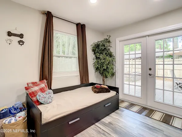 a bedroom with a bed and a window