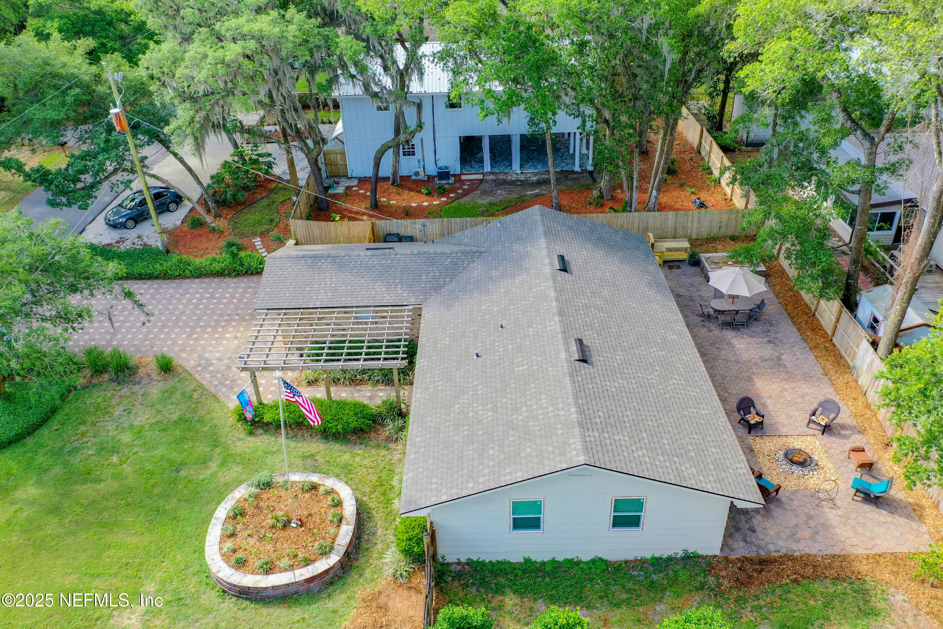460 Lobelia Road St. Augustine, FL 32086 - Photo 32 of 34 an aerial view of a house with garden space and swimming pool