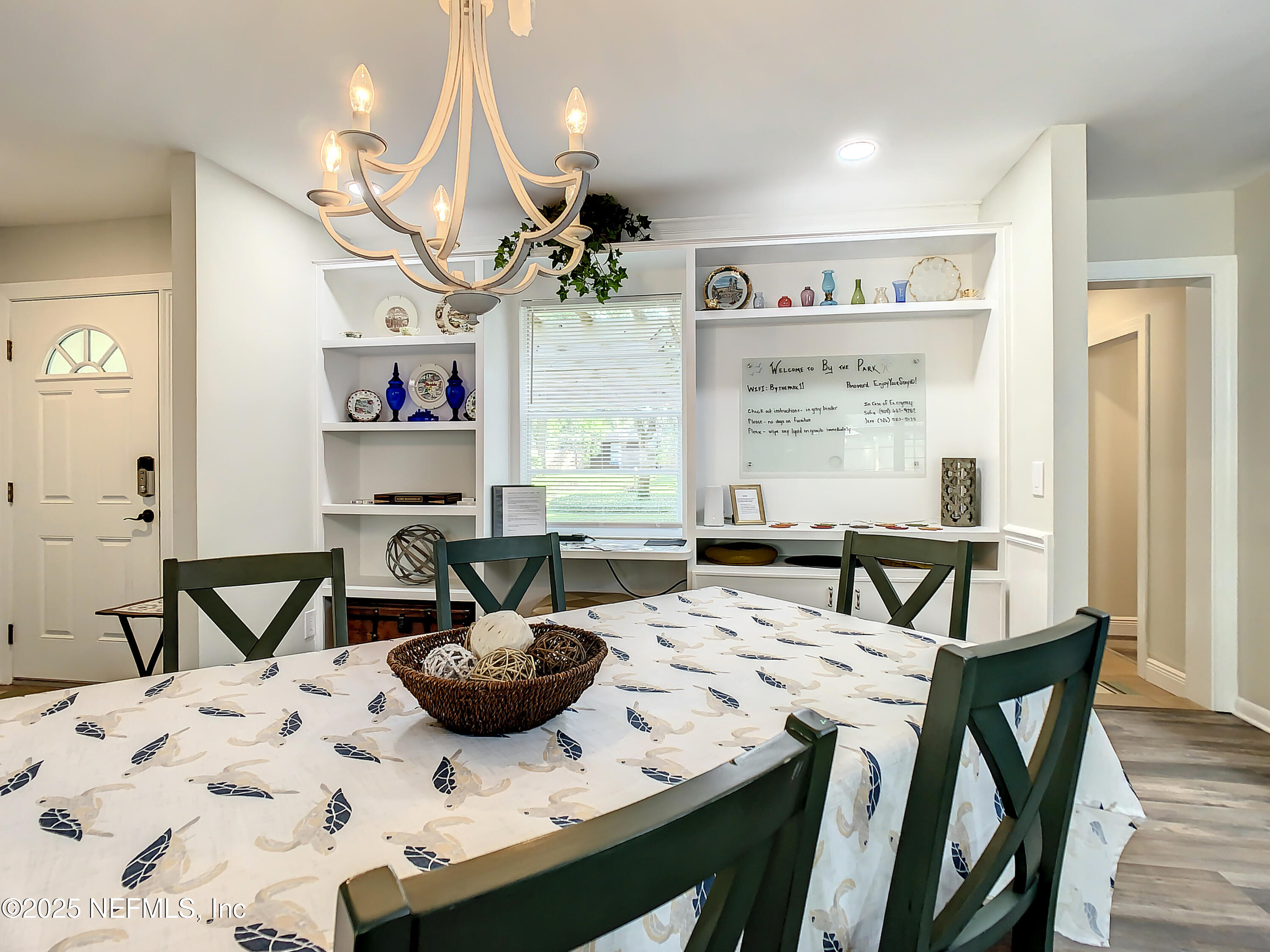 460 Lobelia Road St. Augustine, FL 32086 - Photo 6 of 34 a view of a dining room with furniture and a chandelier