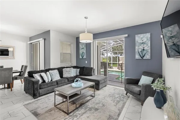 a living room with furniture and a large window