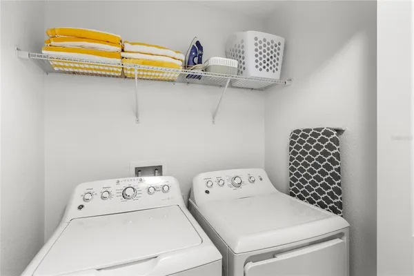 a bathroom with a sink a large mirror and vanity