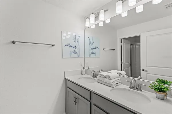 a bathroom with a glass shower door