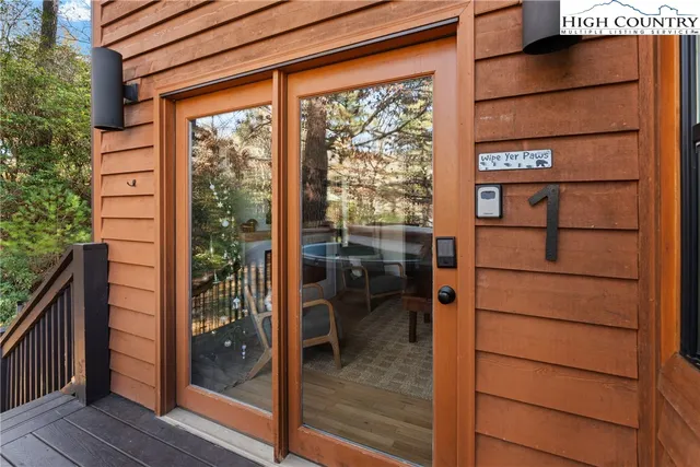 a view of a balcony with a potted plant and stairs