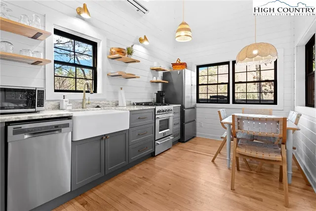 a kitchen with a sink stove and cabinets