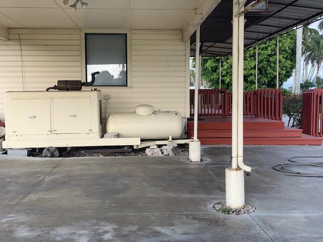 2727 Bacom Point Road Pahokee, FL 33476 - Photo 27 of 27 View under carport