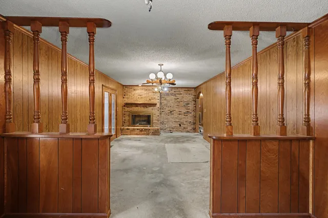 a view of a livingroom with furniture and stairs