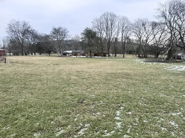 a view of yard covered with snow