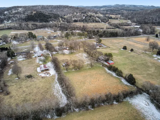a view of a house with a yard and garage