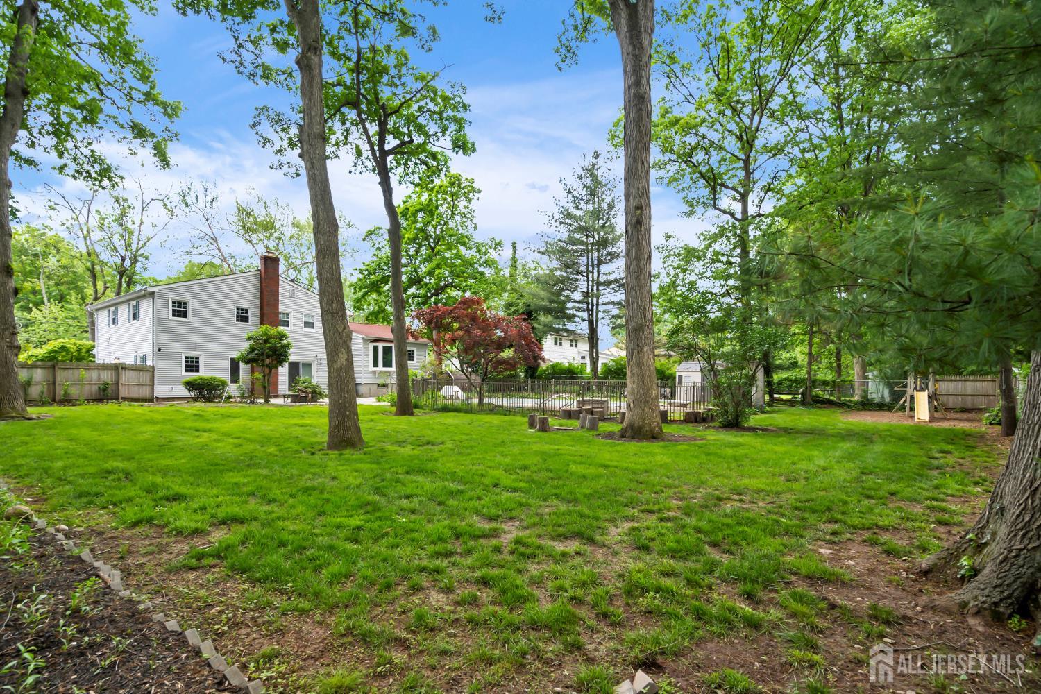10 Woodruff Road Edison, NJ 08820 - Photo 17 of 18 a view of a park with large trees