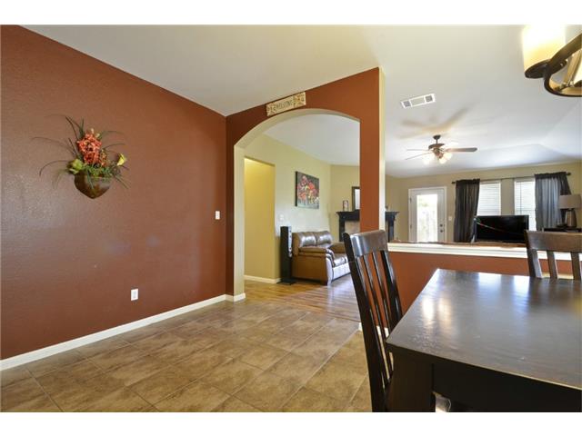 11612 Timber Heights Drive Austin, TX 78754 - Photo 13 of 28 These walls have been painted with neutral color. Archways connect spaces in this inviting home with warm tones and tile flooring.