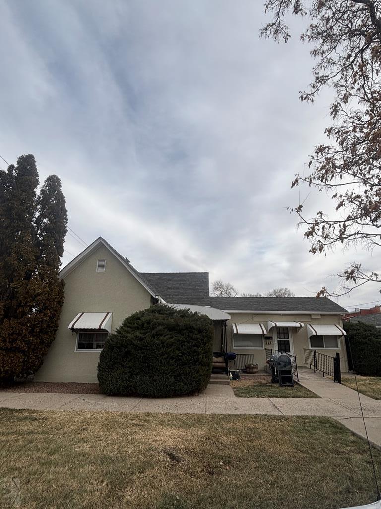113 West Routt Avenue Pueblo, CO 81004 - Photo 1 of 20 a view of a house with a yard and roof
