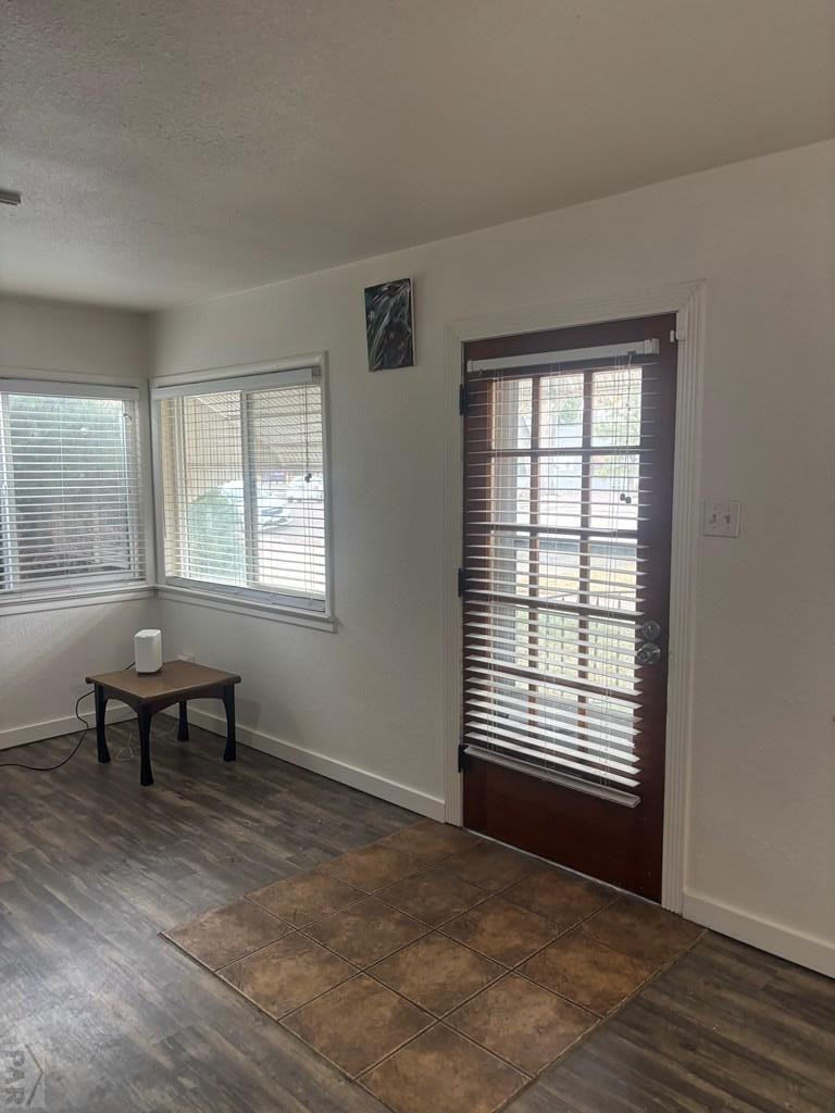 113 West Routt Avenue Pueblo, CO 81004 - Photo 11 of 20 a view of a livingroom with wooden floor and a window