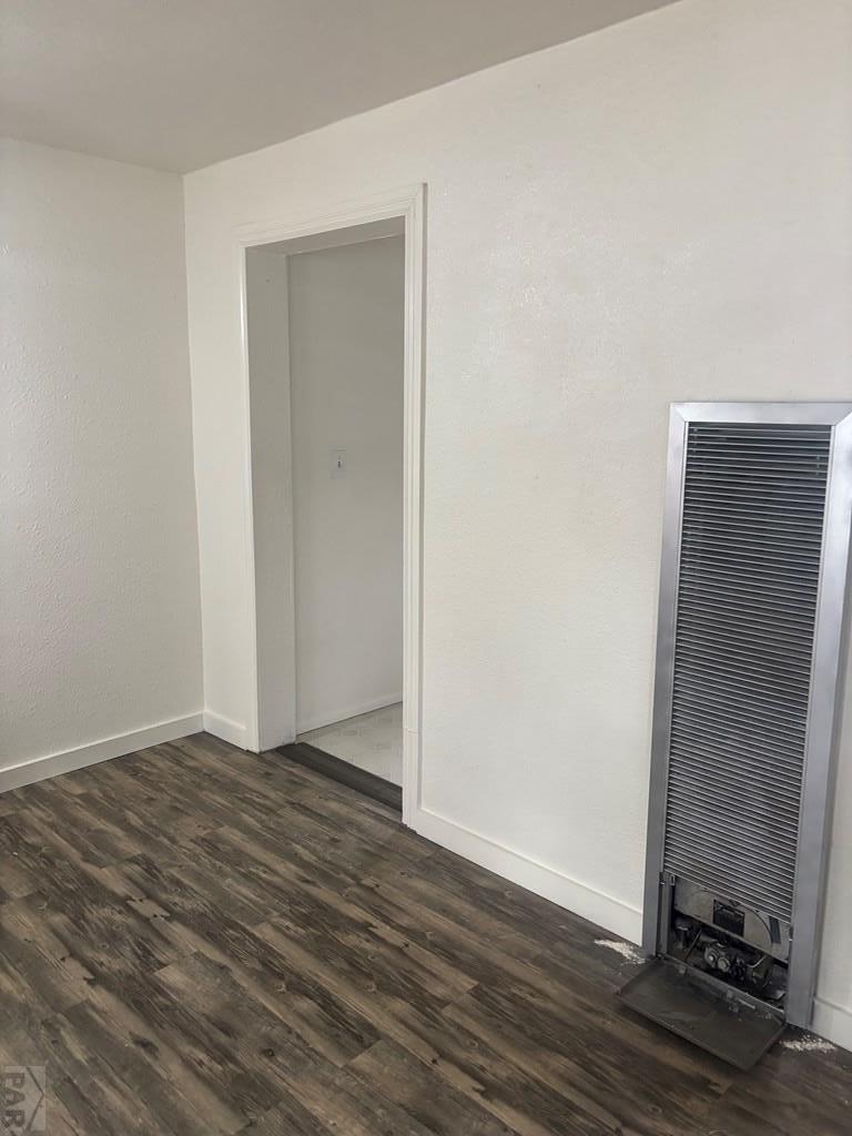 113 West Routt Avenue Pueblo, CO 81004 - Photo 14 of 20 a view of an empty room with wooden floor and a window