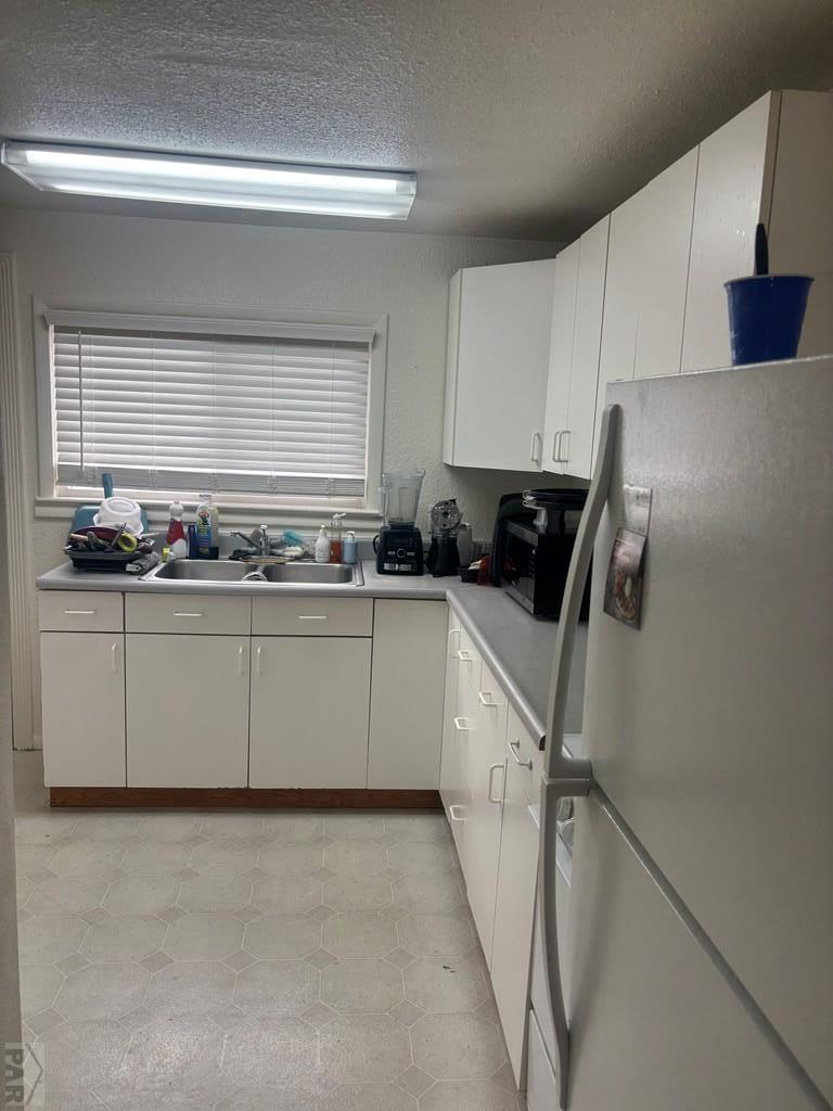 113 West Routt Avenue Pueblo, CO 81004 - Photo 16 of 20 a kitchen with a sink and cabinets