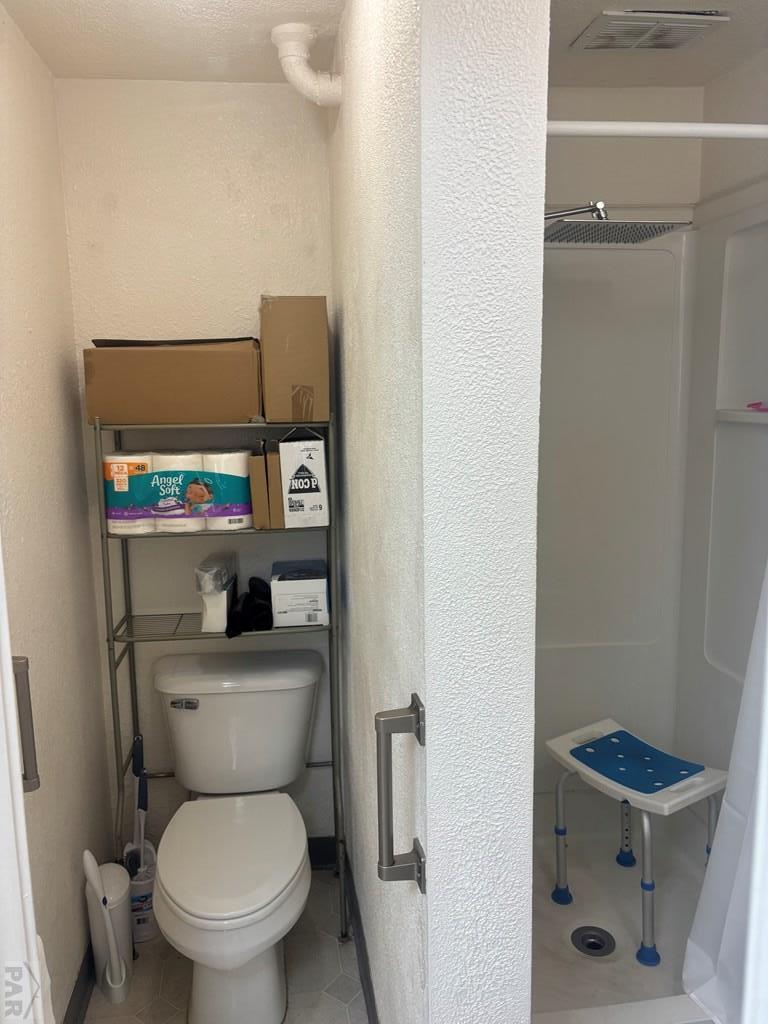 113 West Routt Avenue Pueblo, CO 81004 - Photo 18 of 20 a bathroom with a toilet a sink and a shower
