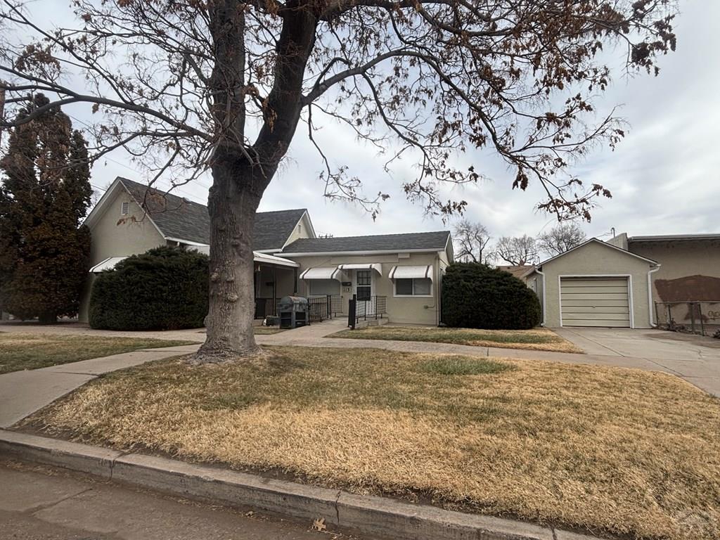 113 West Routt Avenue Pueblo, CO 81004 - Photo 4 of 20 a front view of a house with garden