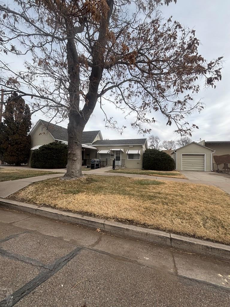 113 West Routt Avenue Pueblo, CO 81004 - Photo 5 of 20 a view of house with trees in the background