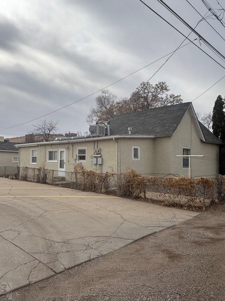 113 West Routt Avenue Pueblo, CO 81004 - Photo 8 of 20 a front view of a house with a yard