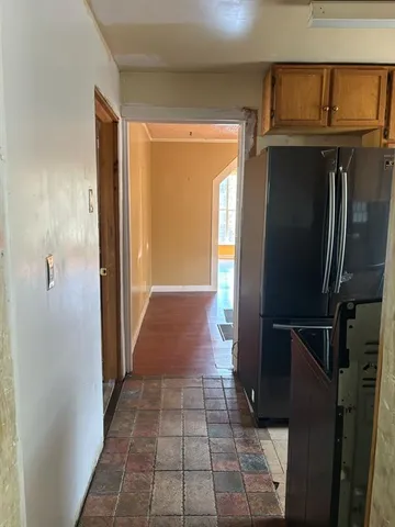 a view of a backyard with large trees