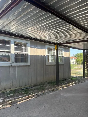 a view of backyard with green space