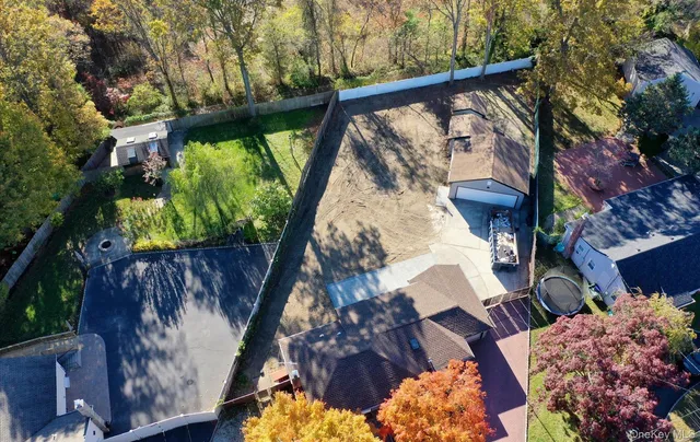 a view of a yard with plants and a patio