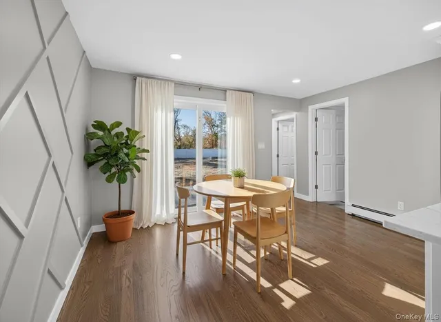 a view of a livingroom with furniture and a potted plant