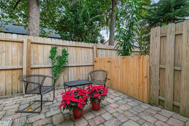 a front view of a house with a yard and a garage
