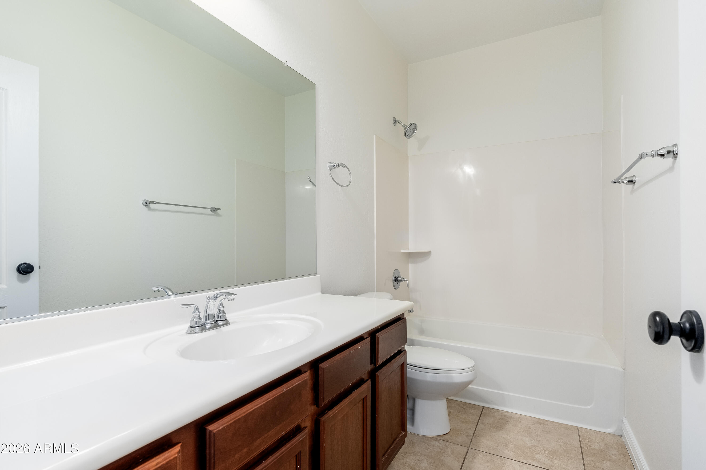 4317 East Folgers Road Phoenix, AZ 85050 - Photo 20 of 40 a bathroom with a sink a toilet and shower