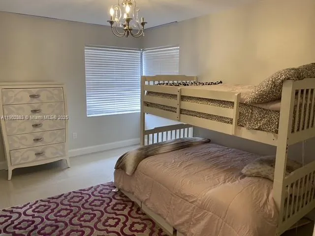 a bathroom with a granite countertop sink a mirror and vanity