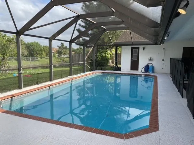 a bedroom with a bed and dresser