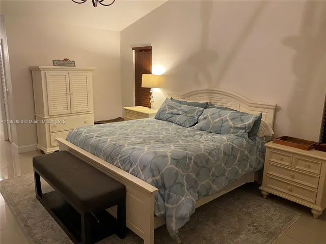 a bathroom with a granite countertop bathtub and sink