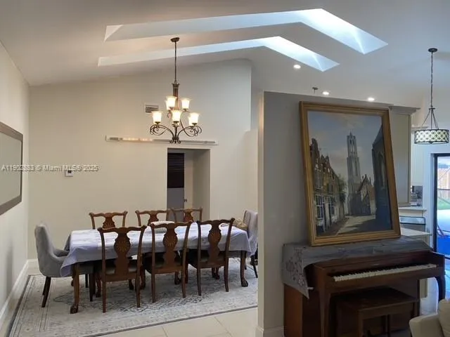 a dining room with furniture and window