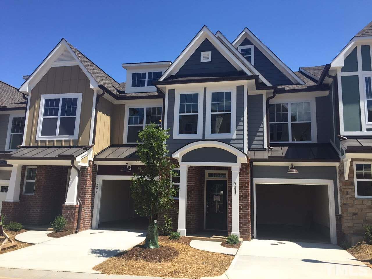 741 Fallon Grove Way Raleigh, NC 27608 - Photo 1 of 16 a front view of a house with a yard