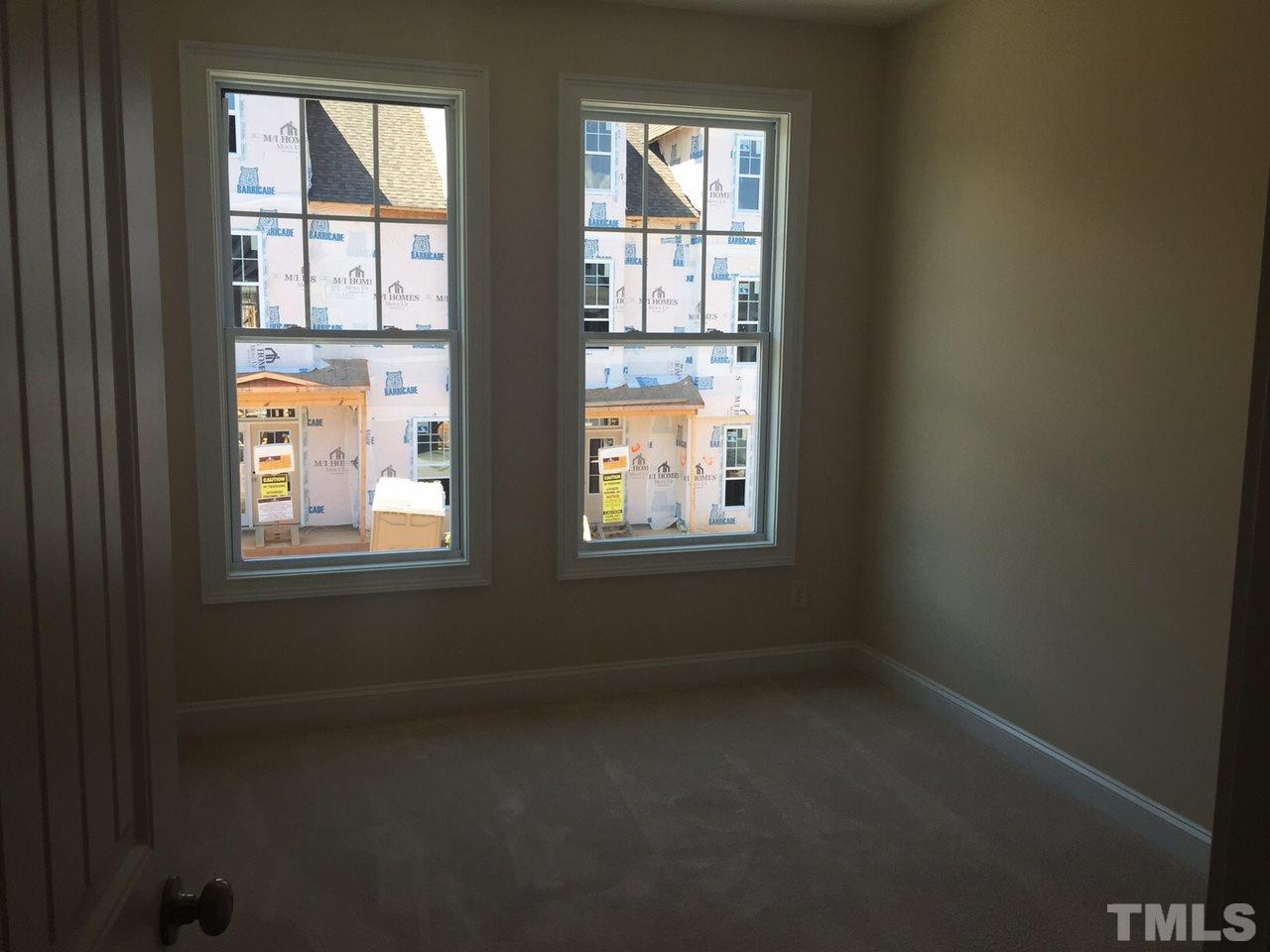 741 Fallon Grove Way Raleigh, NC 27608 - Photo 14 of 16 an empty room with a window