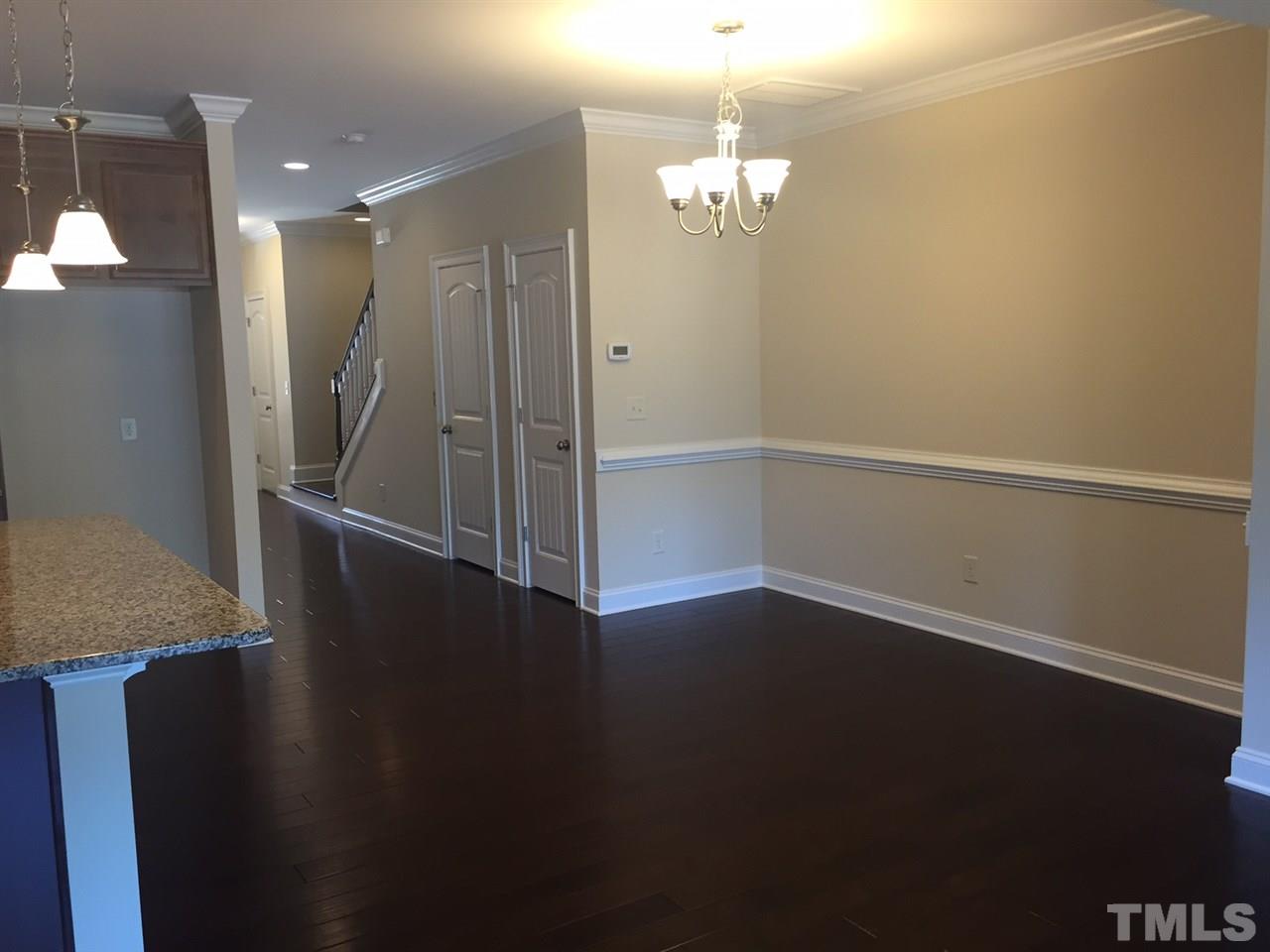 741 Fallon Grove Way Raleigh, NC 27608 - Photo 7 of 16 wooden floor in an empty room with wooden floor