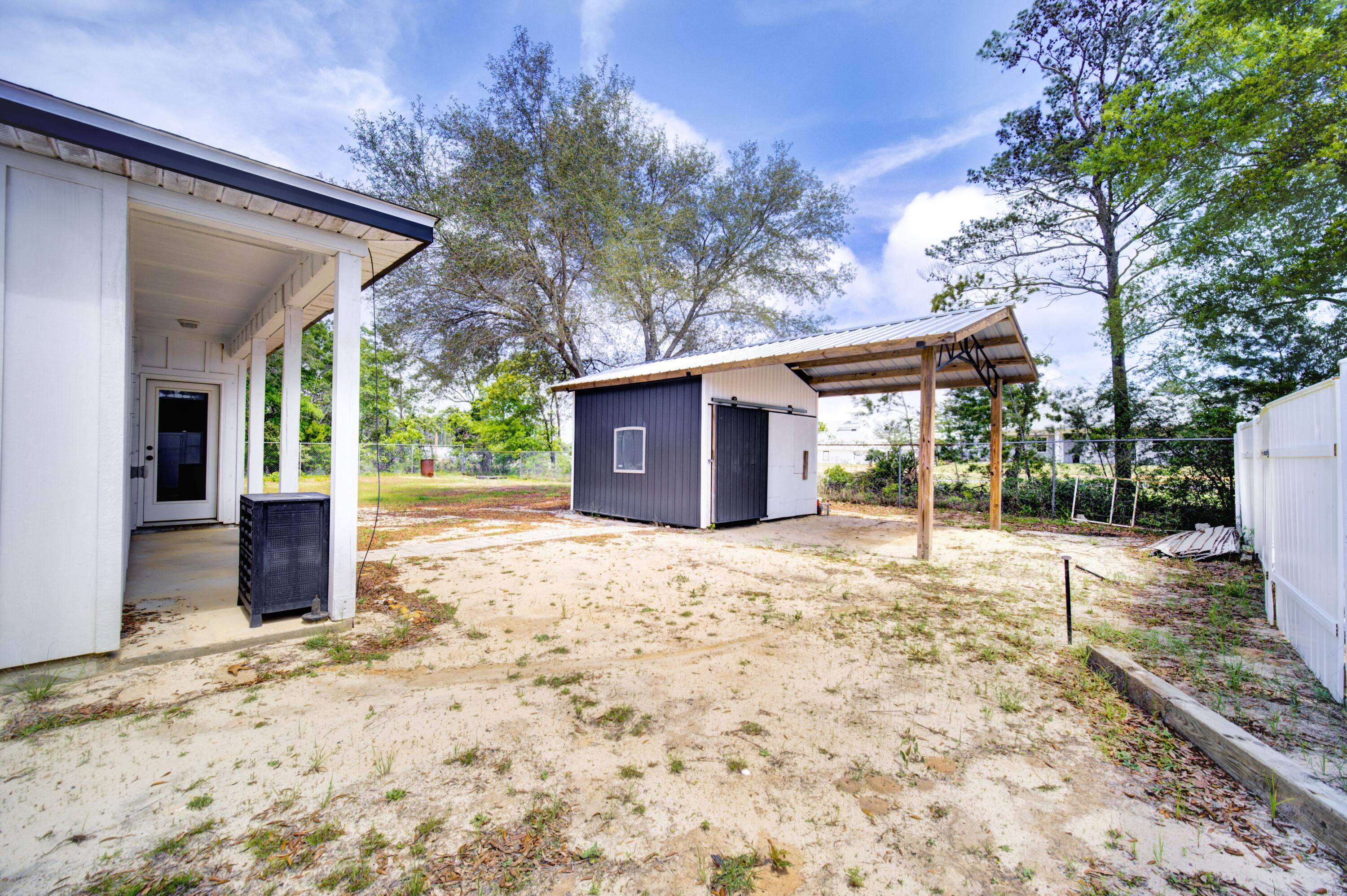 2734 Jewell Road Navarre, FL 32566 - Photo 10 of 32 Storage shed