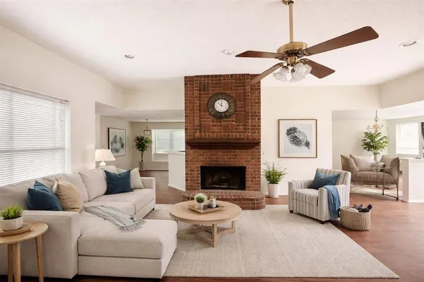 a living room with furniture and a fireplace