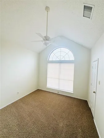 an empty room with a empty space and windows