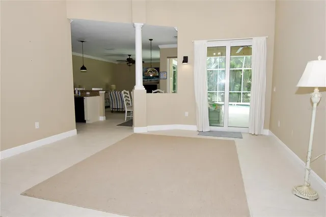 a view of a swimming pool with a yard in front of it