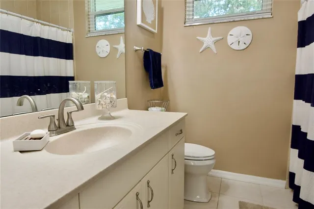 a view of a park with iron fence