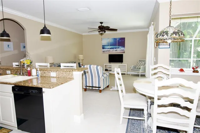 a balcony with furniture and a chandelier