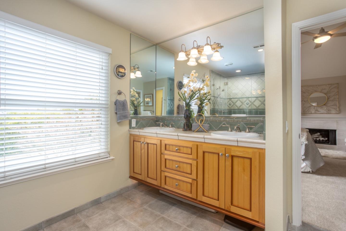 360 Apricot Lane Mountain View, CA 94040 - Photo 11 of 25 a bathroom with a sink a vanity and a large mirror