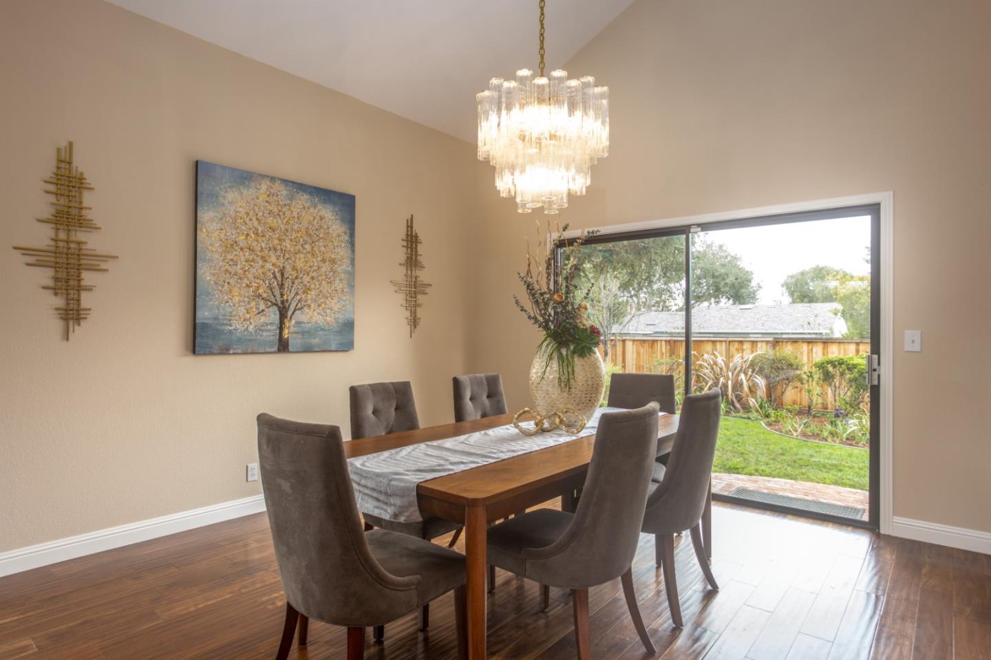 360 Apricot Lane Mountain View, CA 94040 - Photo 4 of 25 a view of a dining room with furniture wooden floor and a chandelier