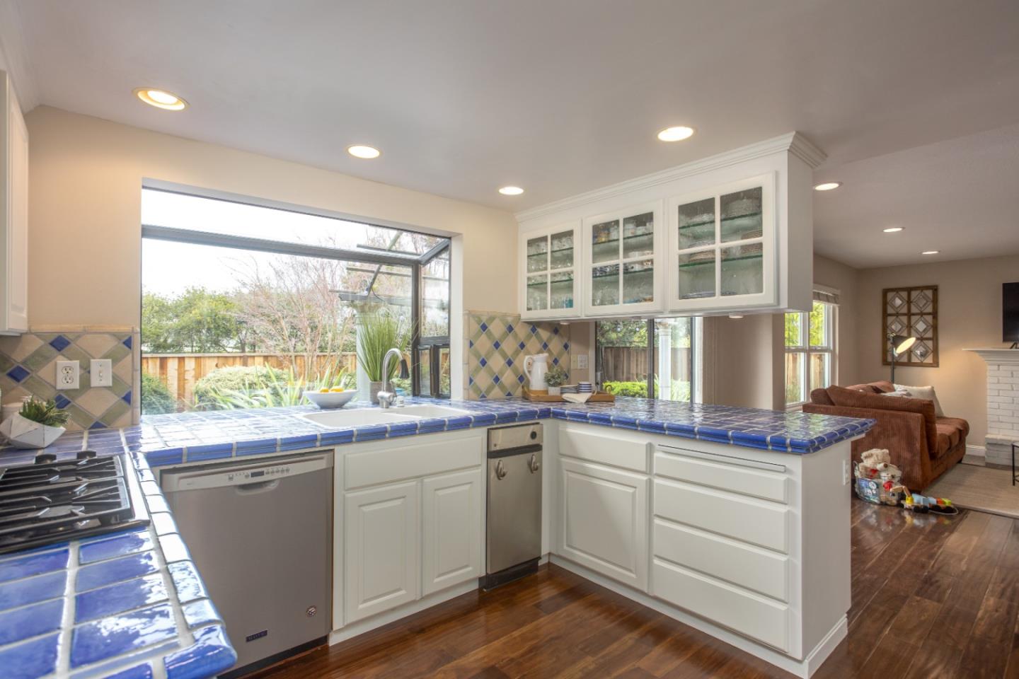 360 Apricot Lane Mountain View, CA 94040 - Photo 5 of 25 a kitchen with a sink stove and cabinets