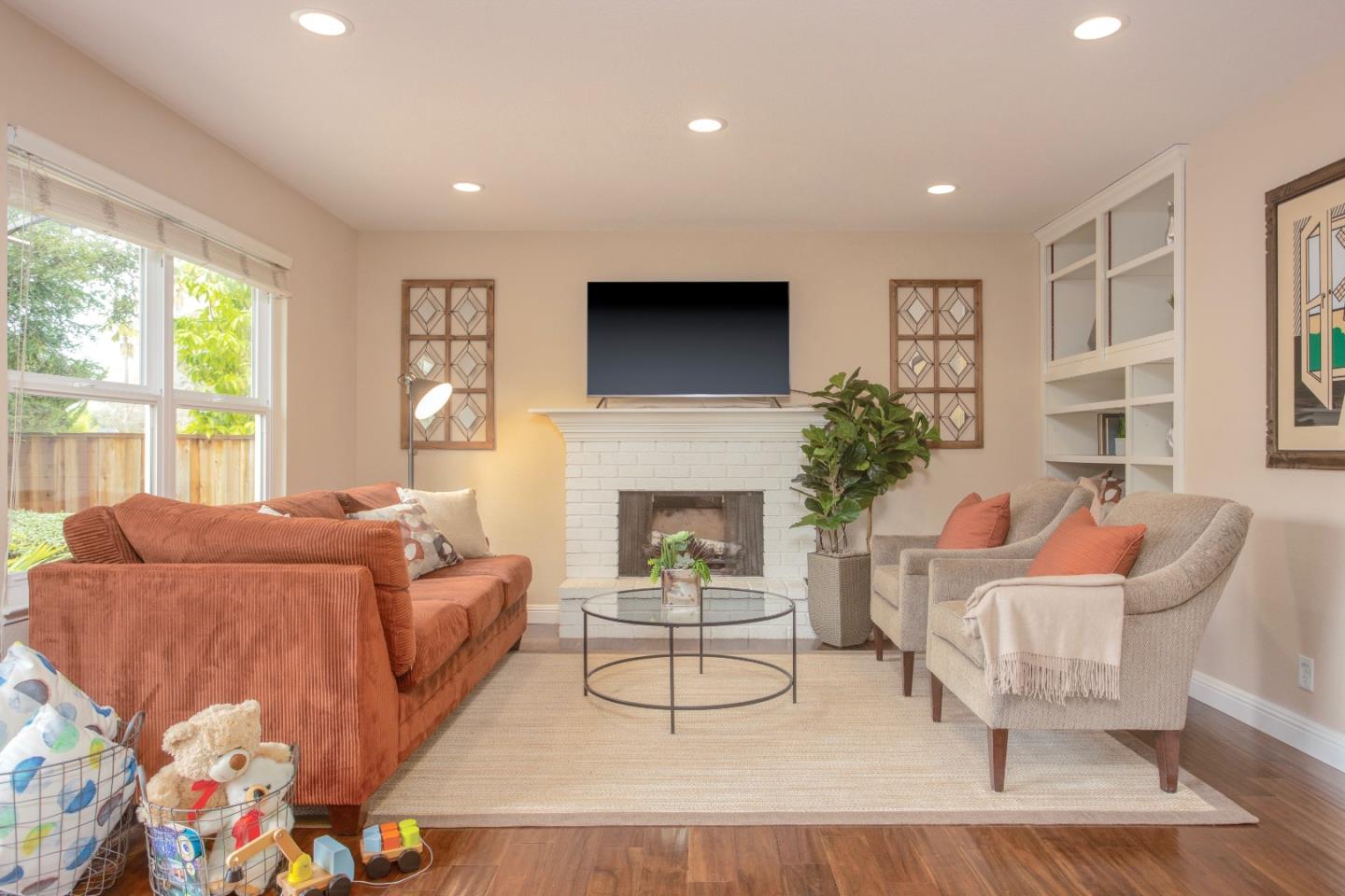 360 Apricot Lane Mountain View, CA 94040 - Photo 9 of 25 a living room with furniture a fireplace and a large window