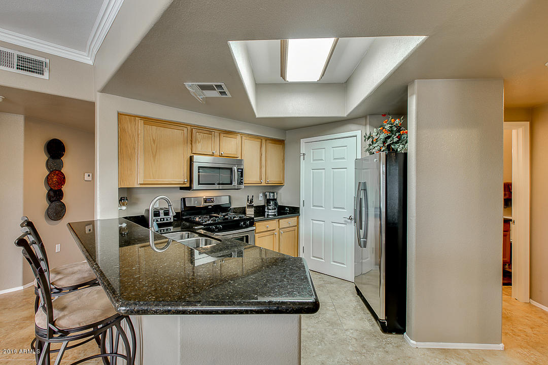 10030 West Indian School Road, Unit 269 Phoenix, AZ 85037 - Photo 11 of 34 a view of a dining room with furniture