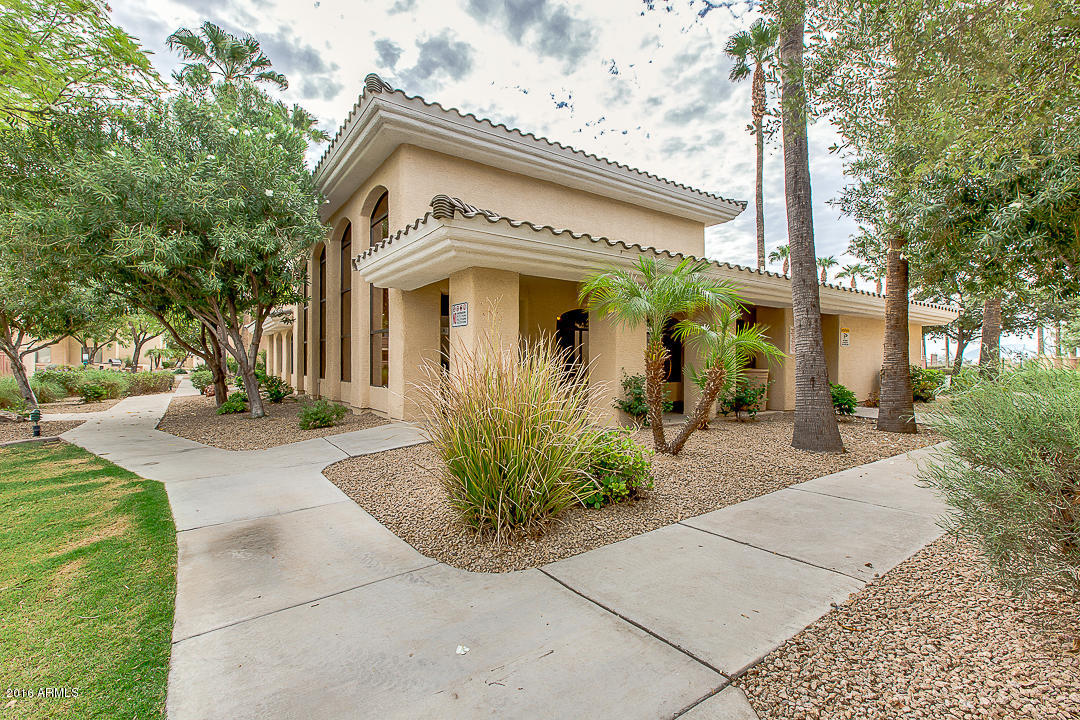 10030 West Indian School Road, Unit 269 Phoenix, AZ 85037 - Photo 27 of 34 a front view of a house with garden