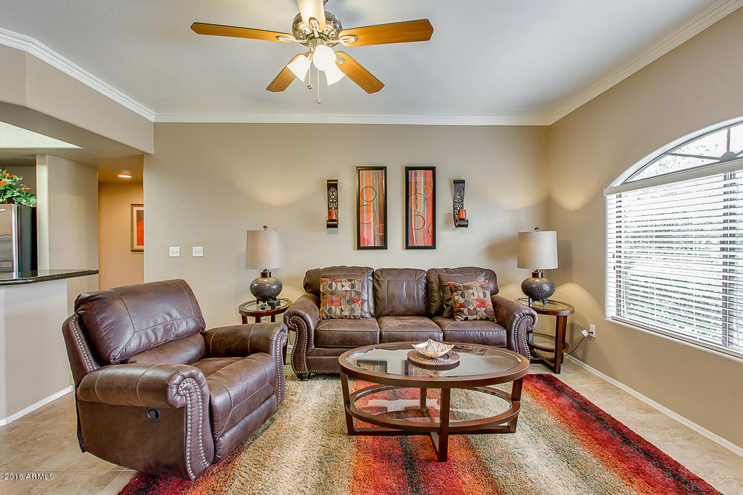 10030 West Indian School Road, Unit 269 Phoenix, AZ 85037 - Photo 9 of 34 a living room with furniture and a window