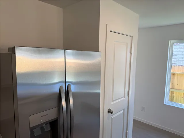 a bathroom with a glass shower door