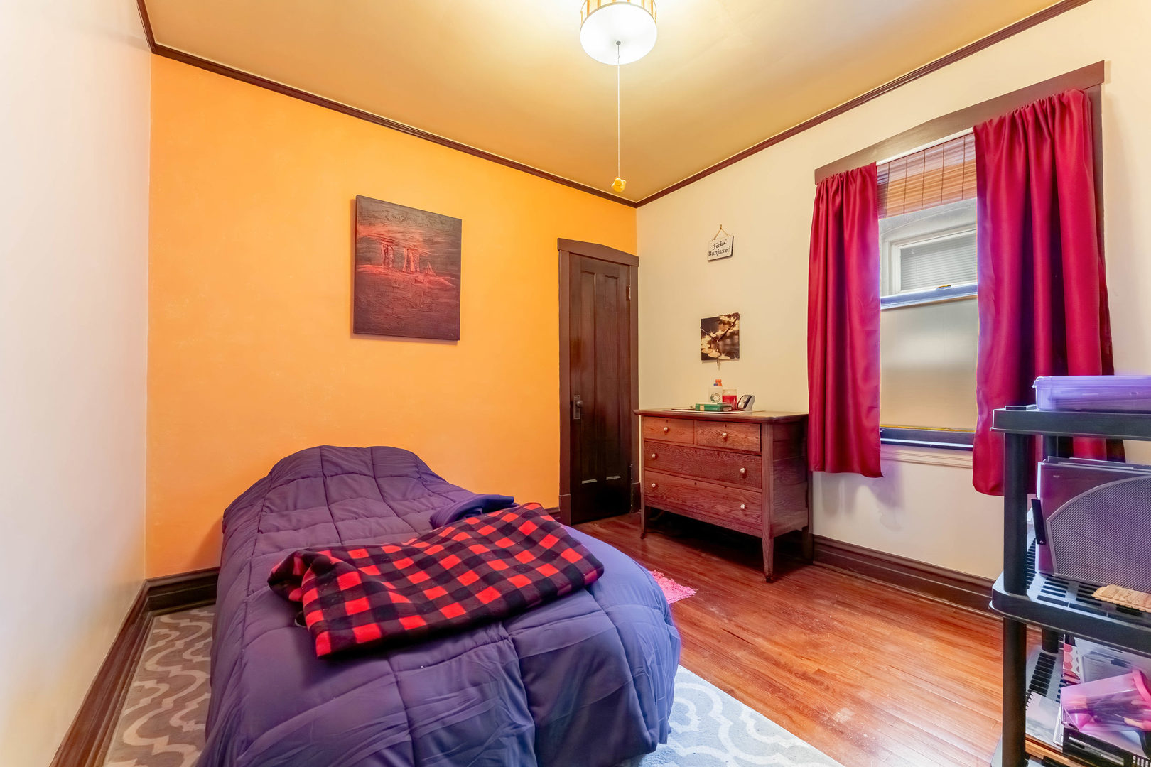 5815 West School Street Chicago, IL 60634 - Photo 13 of 20 a bedroom with a bed and wooden floor